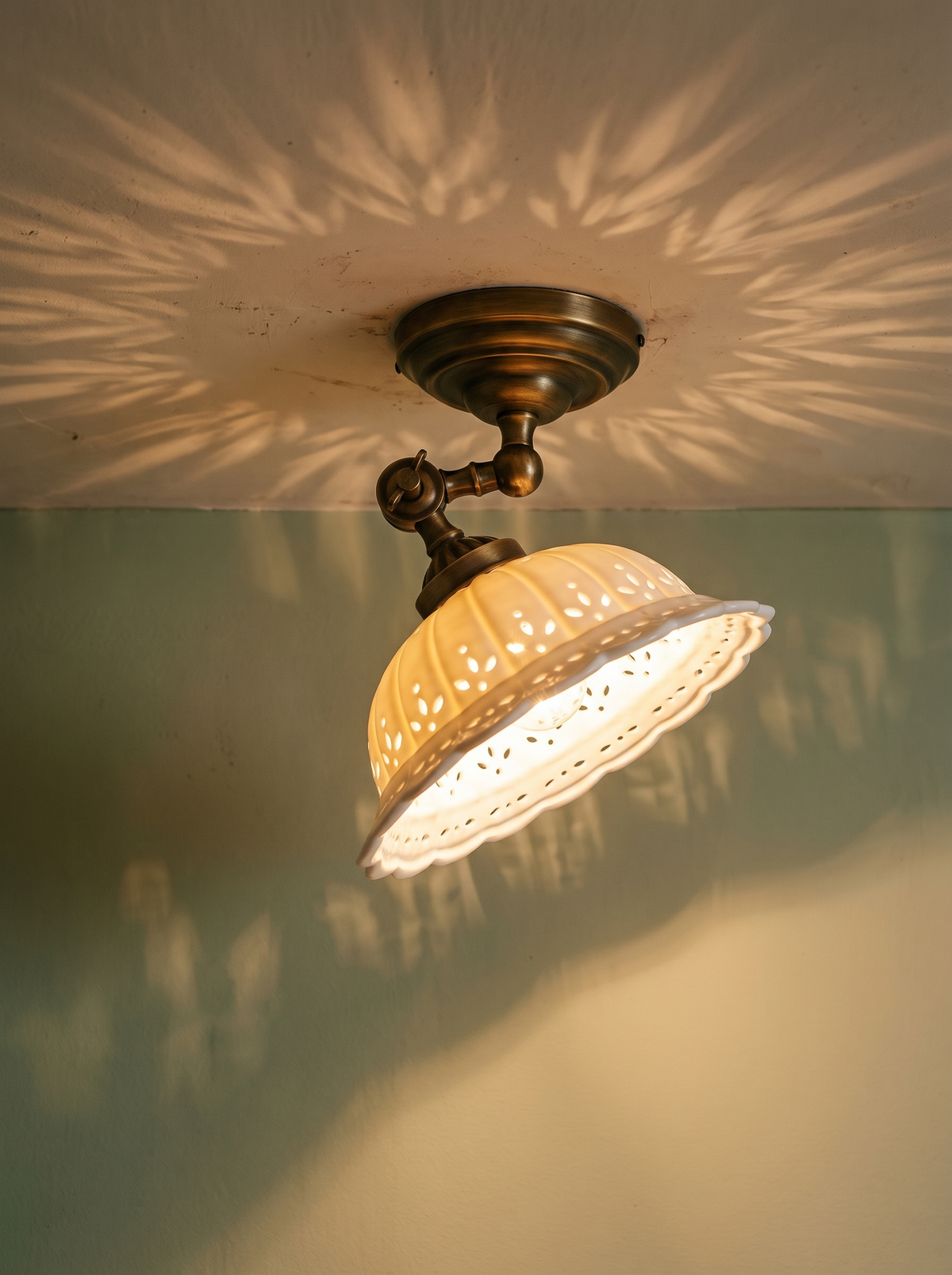 Lifestyle: Colette ceiling light lit at dusk casting a lace pattern