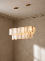 Marelle oval shell chandelier hanging in a plaster-moulded corner