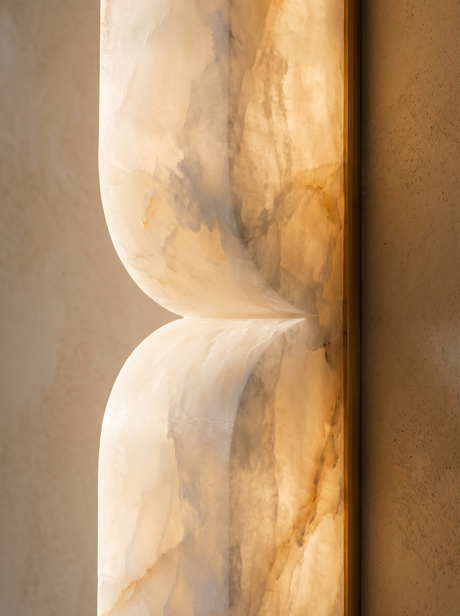 Lifestyle: close-up of Aurelie's carved alabaster curves and veining, lit