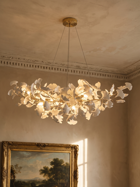 Ginevra porcelain ginkgo leaf chandelier in gold under a moulded plaster ceiling