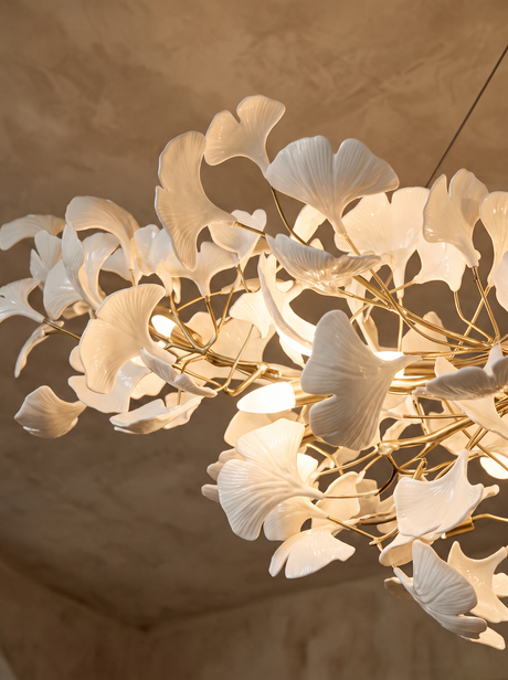 Lifestyle: close-up of Ginevra's hand-formed porcelain ginkgo leaves, lit