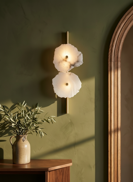 Seren two-disc alabaster wall sconce on an olive plaster wall