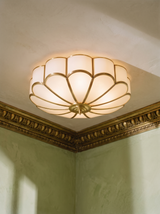 Marguerite frosted glass flower flush mount ceiling light in brass in a plaster-moulded corner