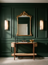 Lifestyle: Clio alabaster sconces flanking a gilt mirror in a forest-green entry, showing their size