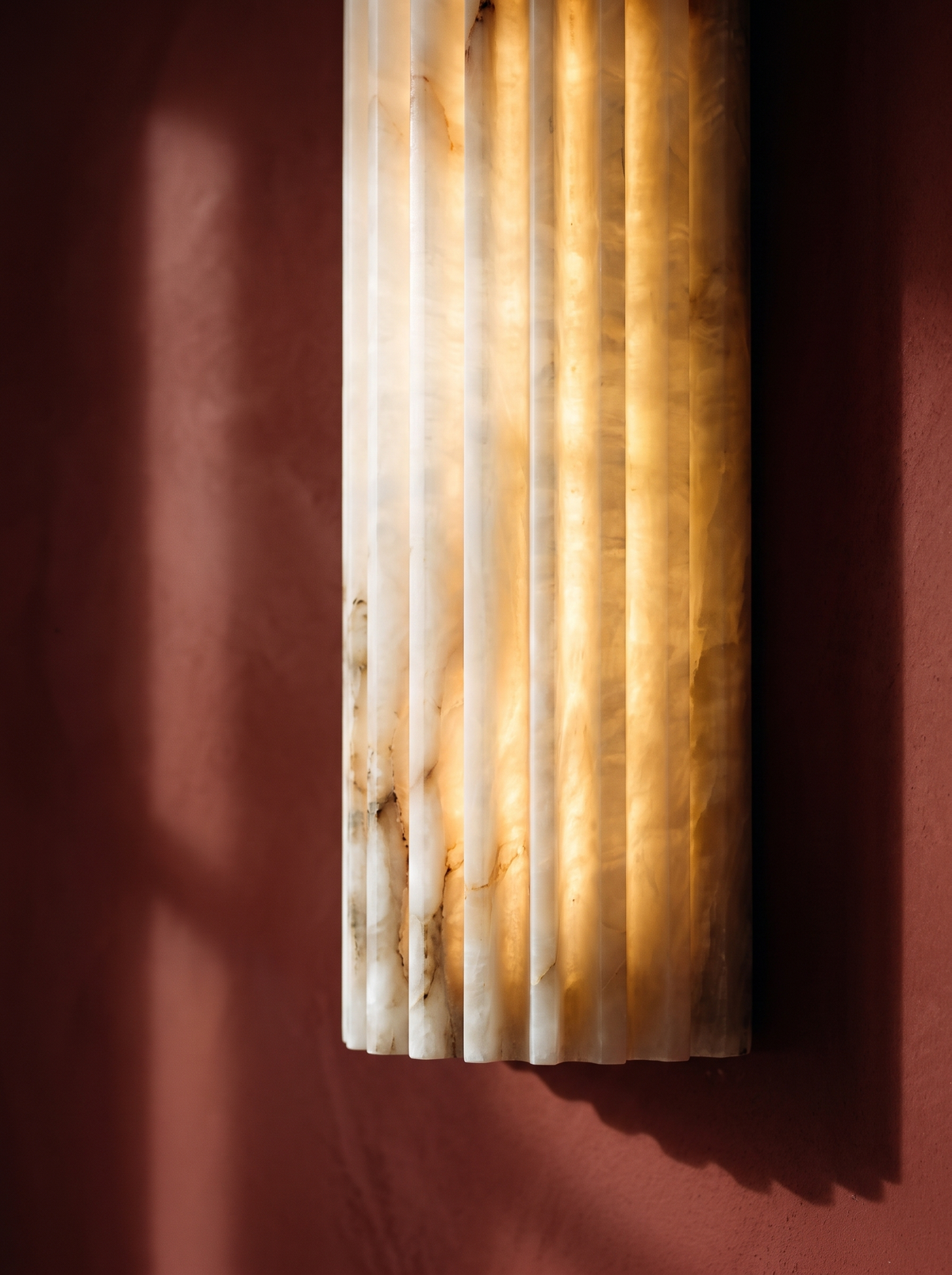 Lifestyle: close-up of Clio's fluted alabaster glowing warm