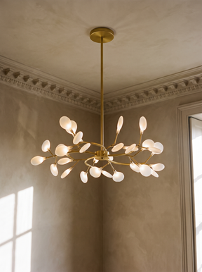 Luce firefly sputnik chandelier in gold hanging in a plaster-moulded corner