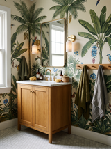 Lifestyle: Pilar alabaster sconce beside a vanity in a jungle-mural bathroom