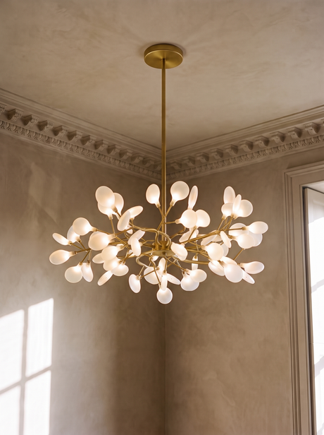 Luce 45-light firefly chandelier in gold hanging in a plaster-moulded corner