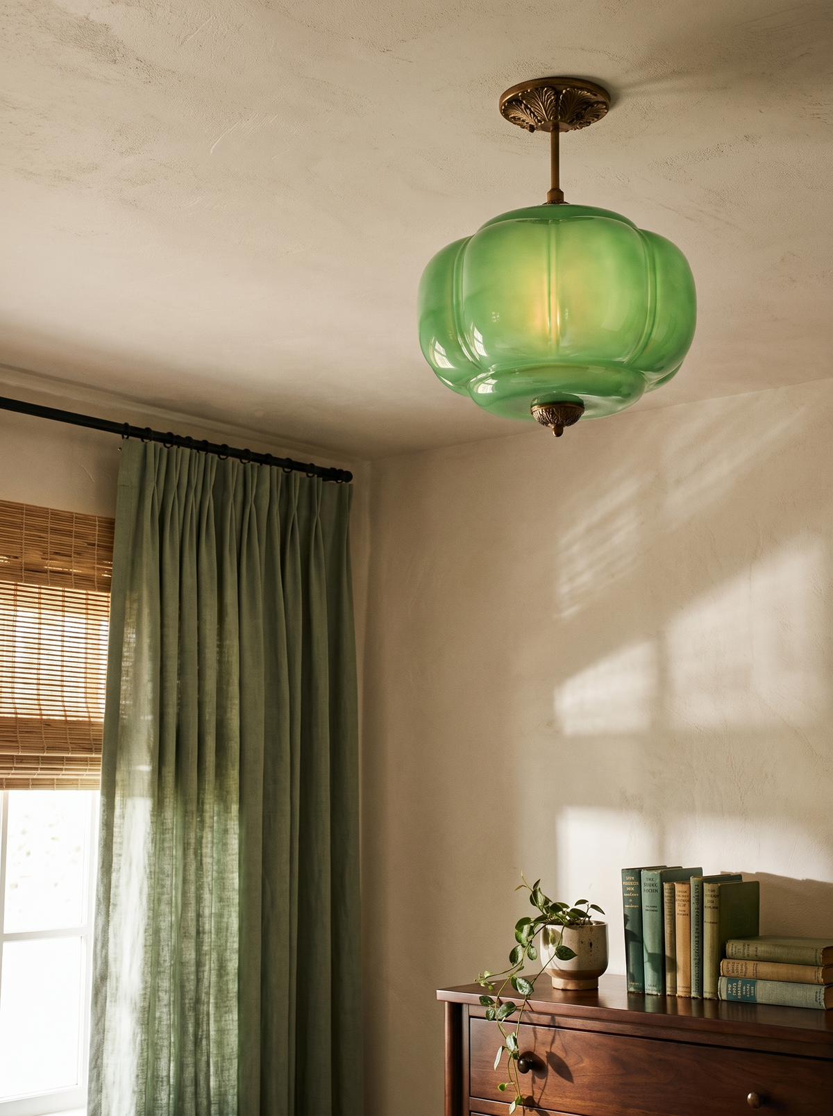 Lifestyle: Ivy green glass ceiling light in a bedroom corner with sage linen curtains