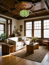 Lifestyle: Ivy green glass ceiling light in an oak-panelled living room, showing its size