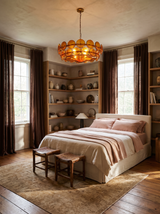 Lifestyle: Soleil amber disc chandelier above a bed in a bedroom with ceramic shelves