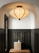 Lifestyle: Bonnie scalloped ceiling light in a charcoal-panelled entry nook