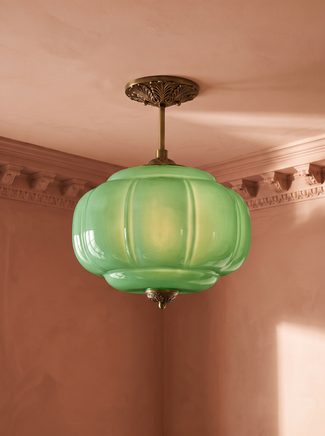 Ivy green glass semi-flush ceiling light in gold hanging in a plaster-moulded corner