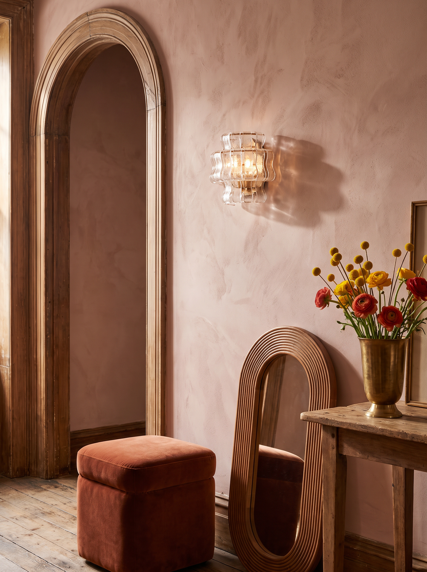 Lifestyle: Sylva sconce beside an arched doorway