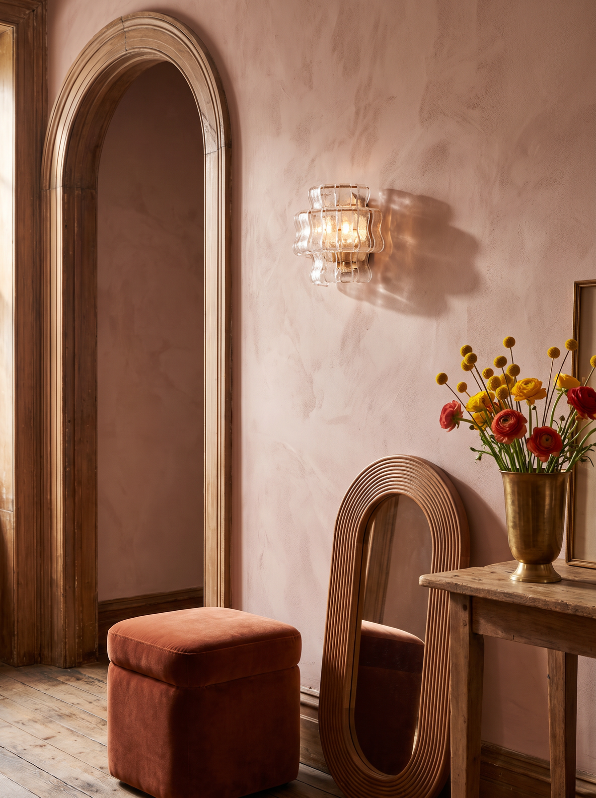 Lifestyle: Sylva sconce beside an arched doorway