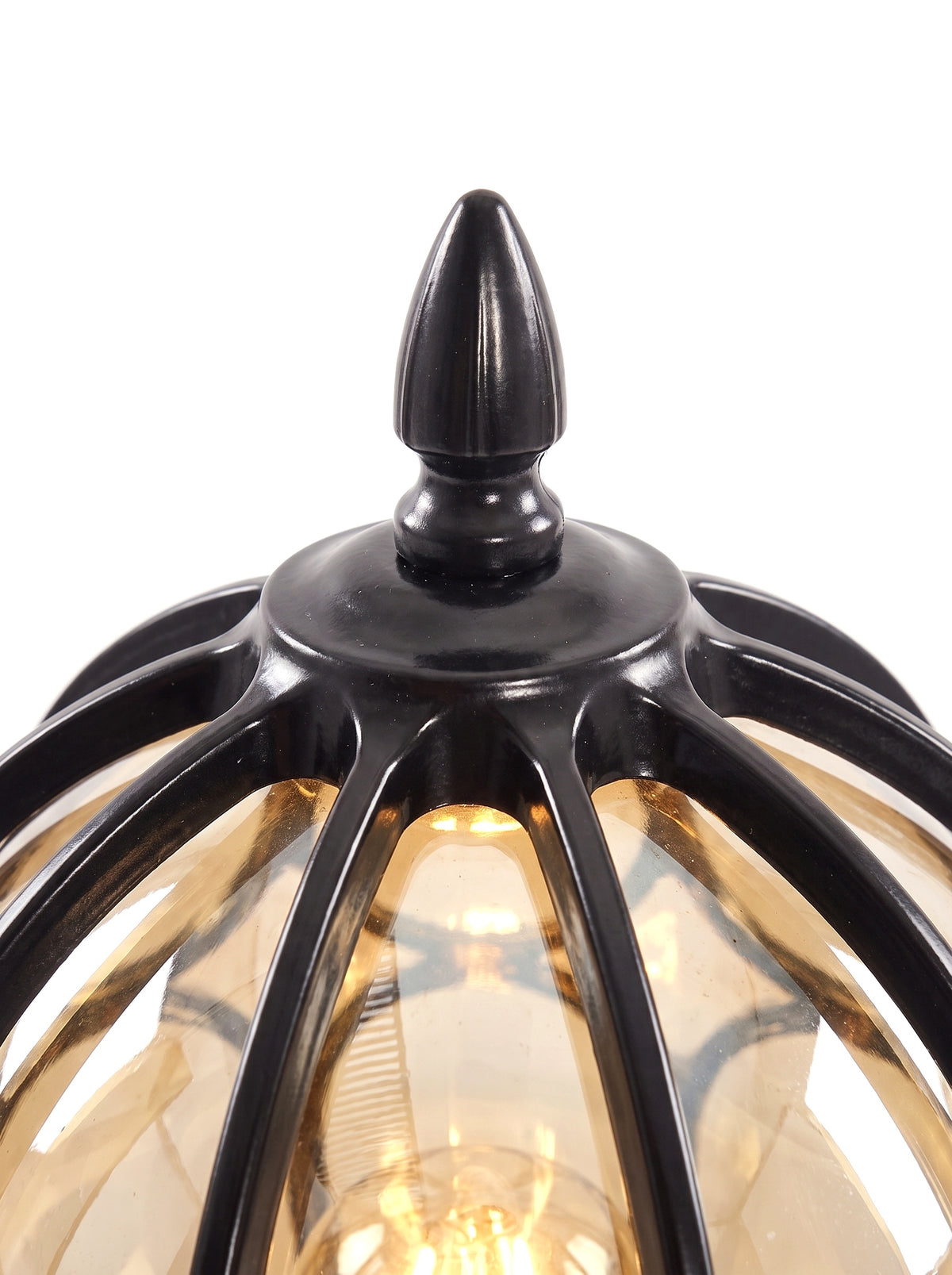 Lune black finial and cage apex with warm amber glow, close-up on pure white