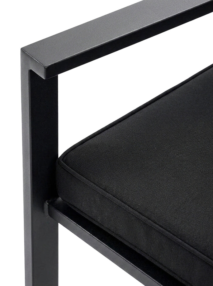 Nero black metal arm and cushion detail, close-up on white