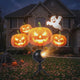 Holiday projector animating Halloween scenes on a house