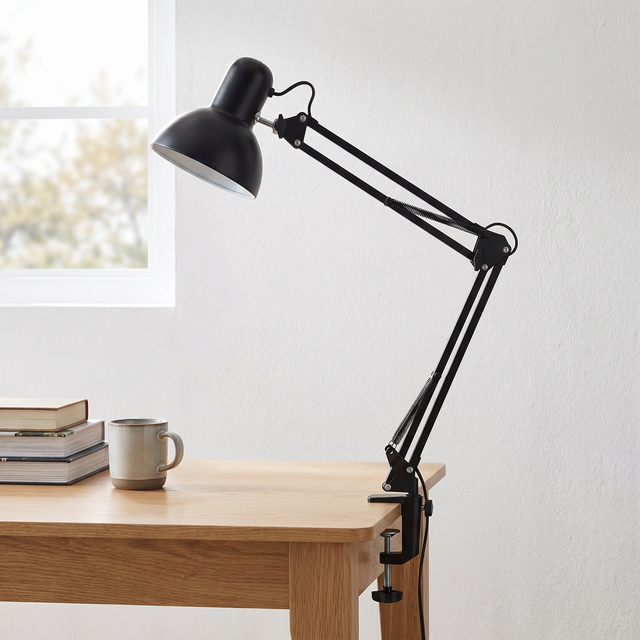 Otis architect clamp lamp in black on a desk