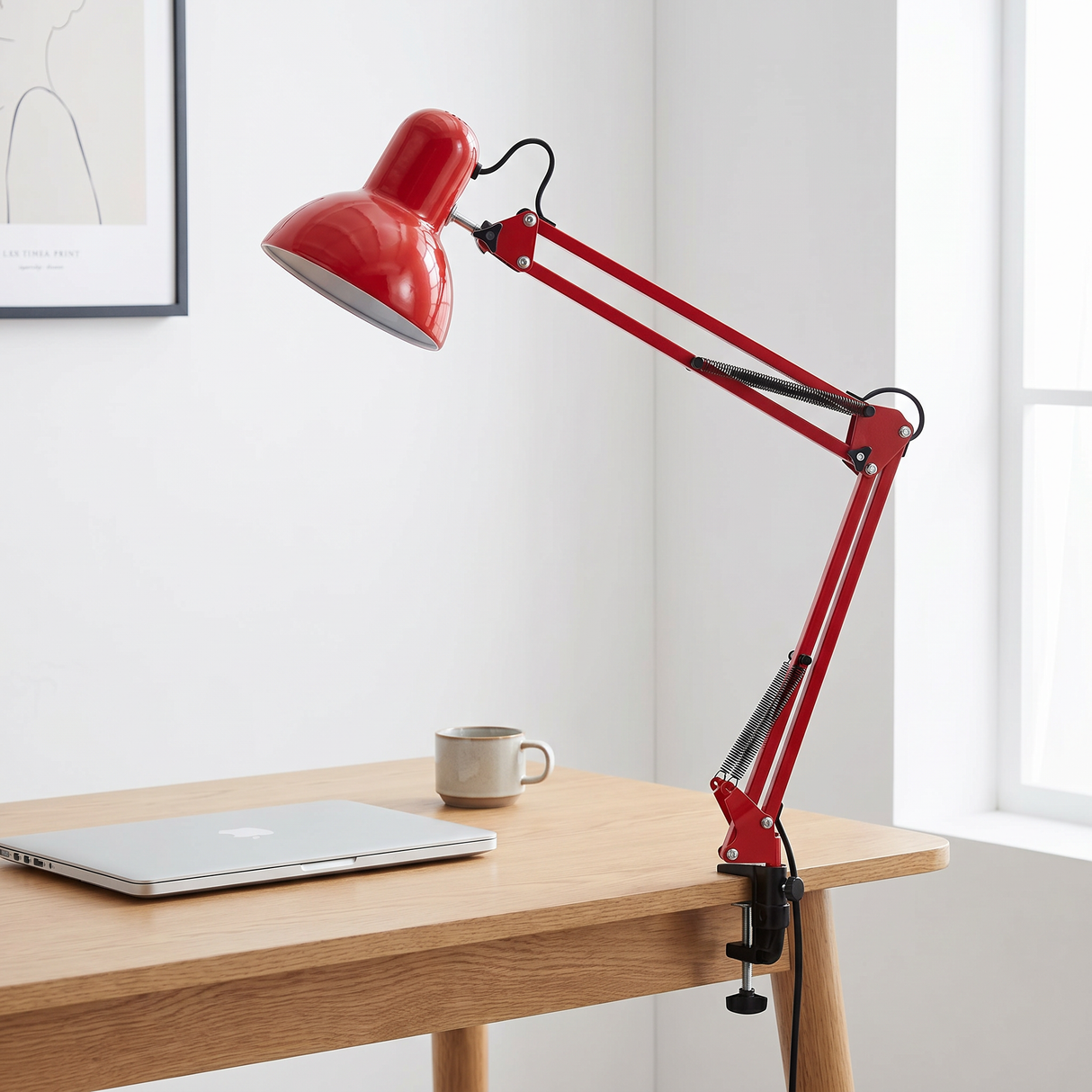 Otis architect clamp lamp in red on a desk