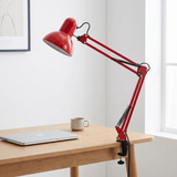 Otis architect clamp lamp in red on a desk