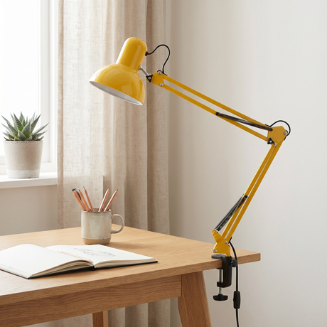 Otis architect clamp lamp in yellow on a desk