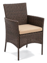 Sabbia single brown wicker armchair with tan cushion, studio view on white