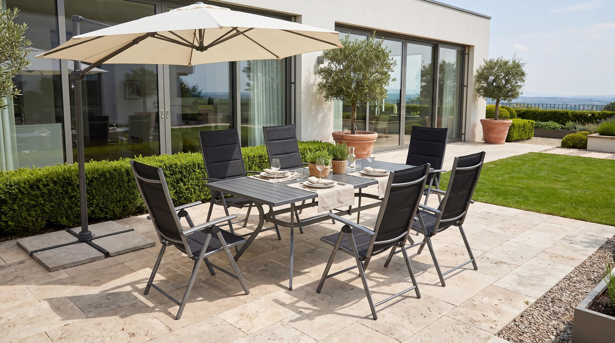 Tavola dining set on a luxury villa terrace with a shade umbrella — lifestyle