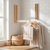 Nils hanger rail in white oak in a laundry room