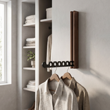 Nils folding hanger rail in walnut with hung shirts