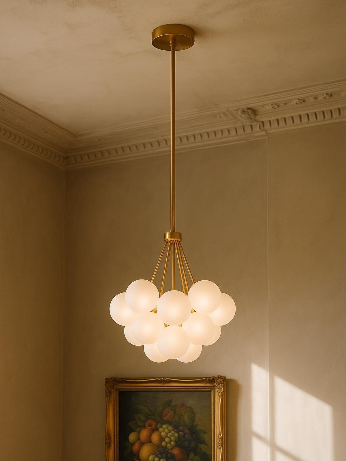 Perle 19-globe frosted glass bubble chandelier in gold in a plaster-moulded corner