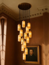 Sola fifteen-pendant alabaster cluster pendant in brass in a sienna plaster corner
