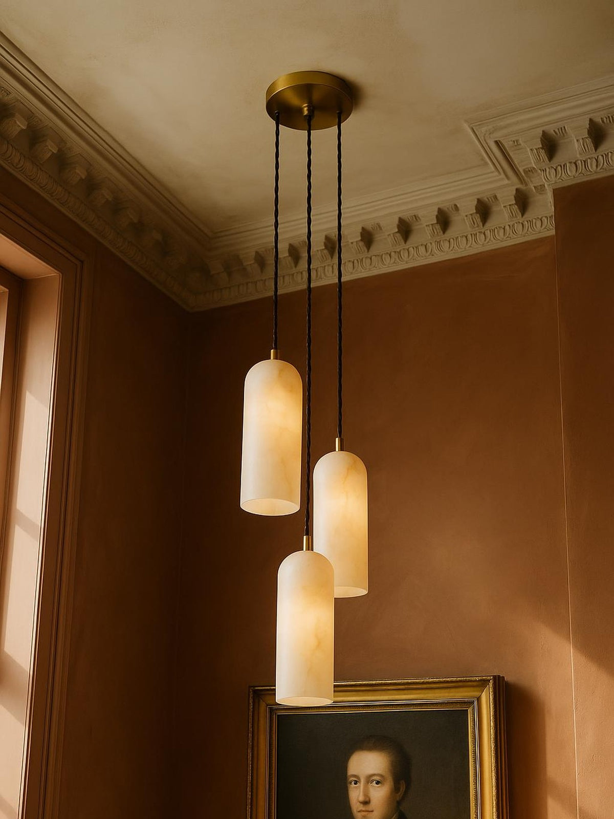 Sola three-pendant alabaster cluster pendant in brass in a sienna plaster corner