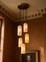 Sola five-pendant alabaster cluster pendant in brass in a sienna plaster corner