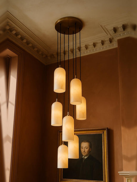 Sola seven-pendant alabaster cluster pendant in brass in a sienna plaster corner