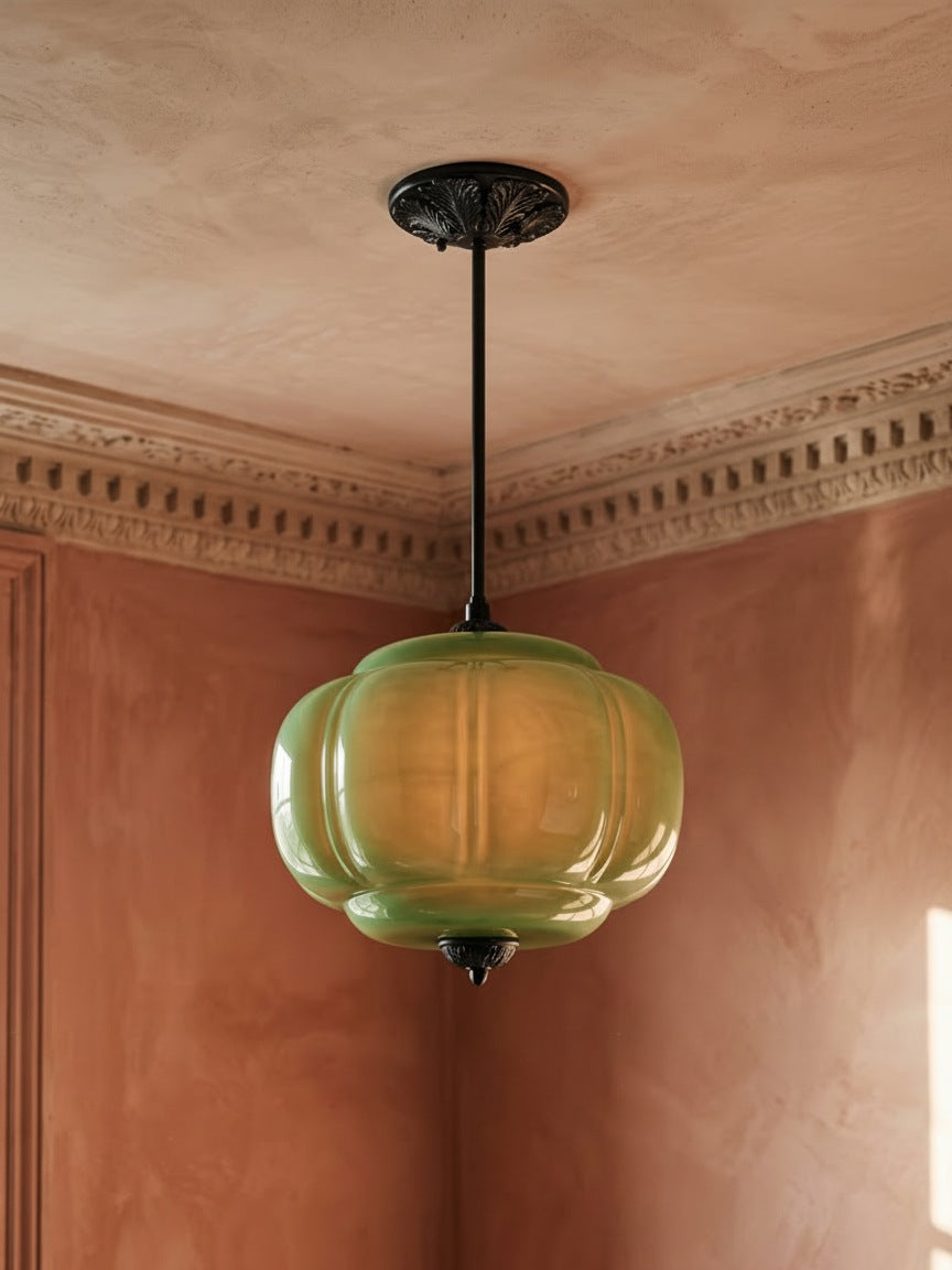 Ivy tall green glass semi-flush ceiling light in black hanging in a plaster-moulded corner