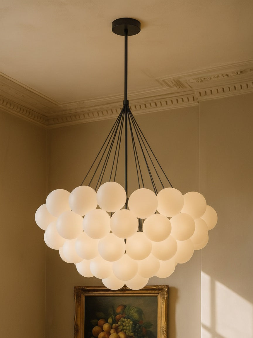 Perle 31-globe frosted glass bubble chandelier in black in a plaster-moulded corner