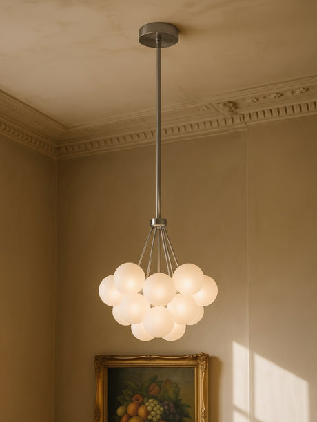 Perle 19-globe frosted glass bubble chandelier in chrome in a plaster-moulded corner