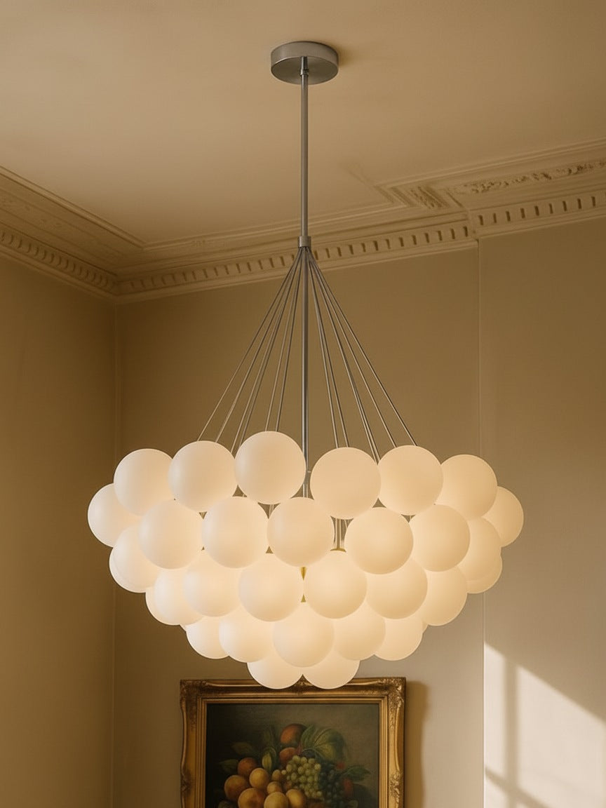 Perle 31-globe frosted glass bubble chandelier in chrome in a plaster-moulded corner