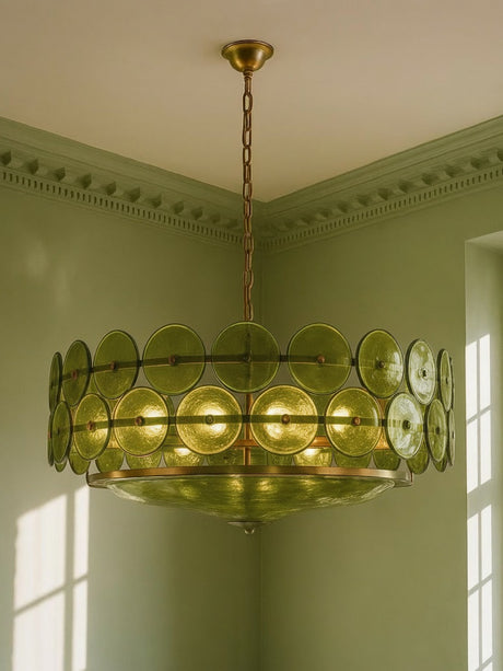 Soleil 31.5-inch olive-green glass disc chandelier hanging in a plaster-moulded corner