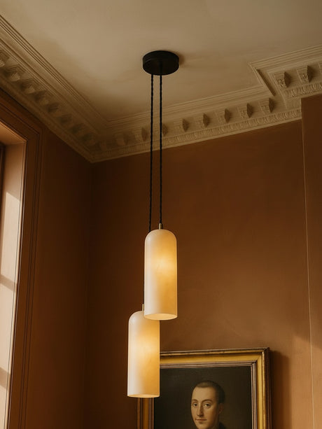 Sola two-pendant alabaster cluster pendant in black in a sienna plaster corner