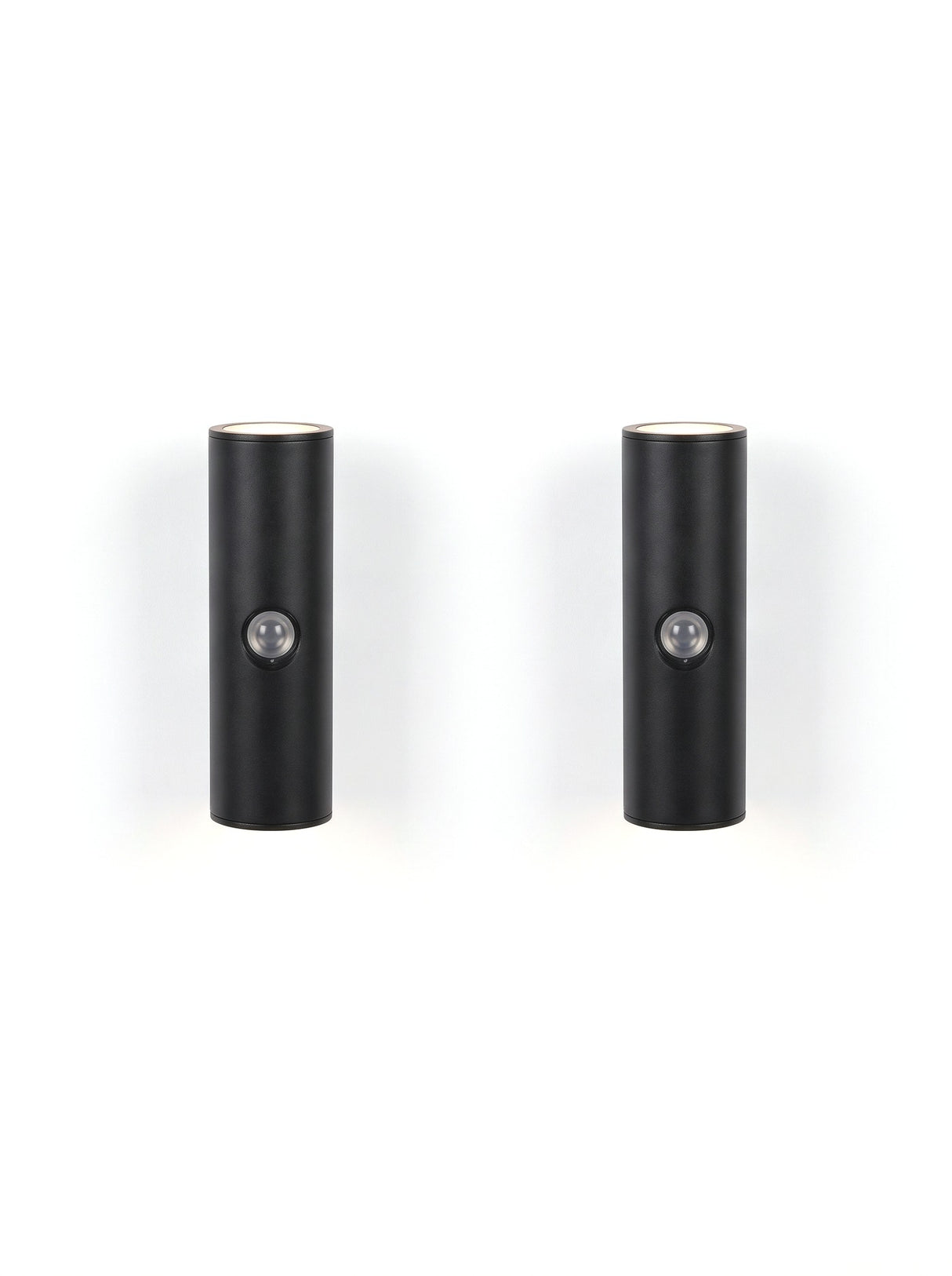 A matched pair of Vega wall lights on white, glowing up and down