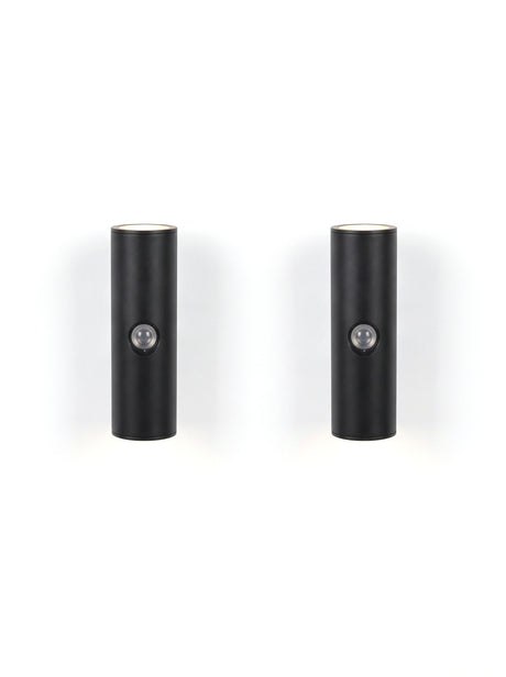 A matched pair of Vega wall lights on white, glowing up and down