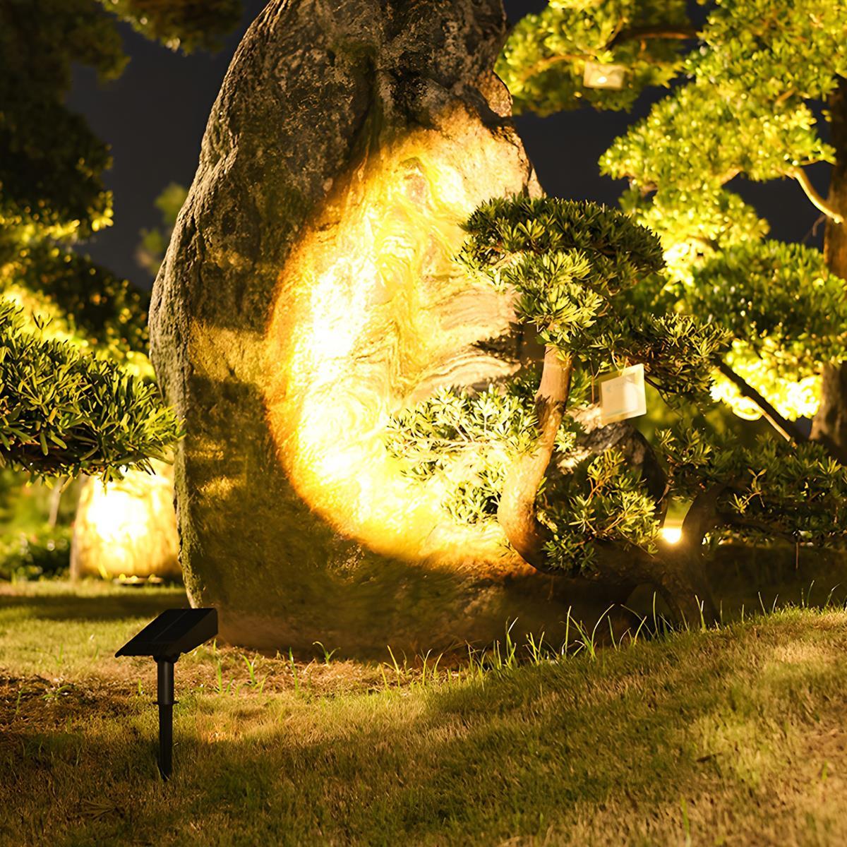 Vale spotlight lighting a garden rock feature