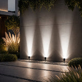 Vale solar spotlights uplighting a wall in cool white